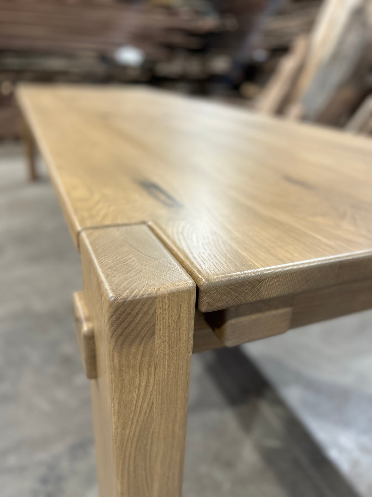 Hollis dining table with oversized legs, angled view