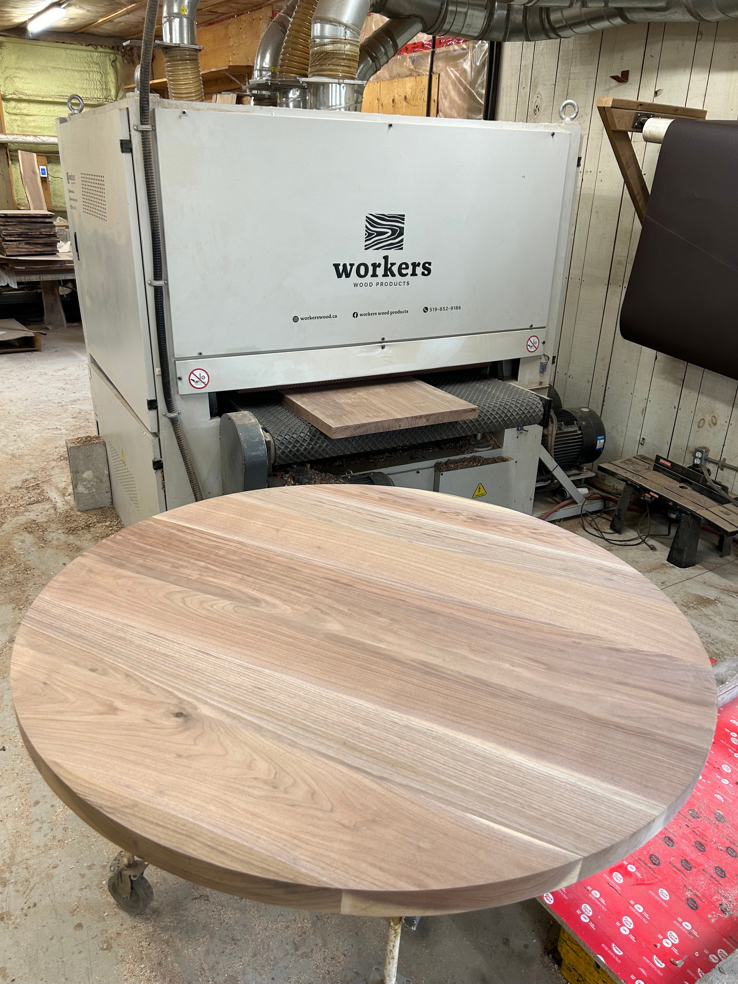 Circle shaped wood table top in Black Walnut
