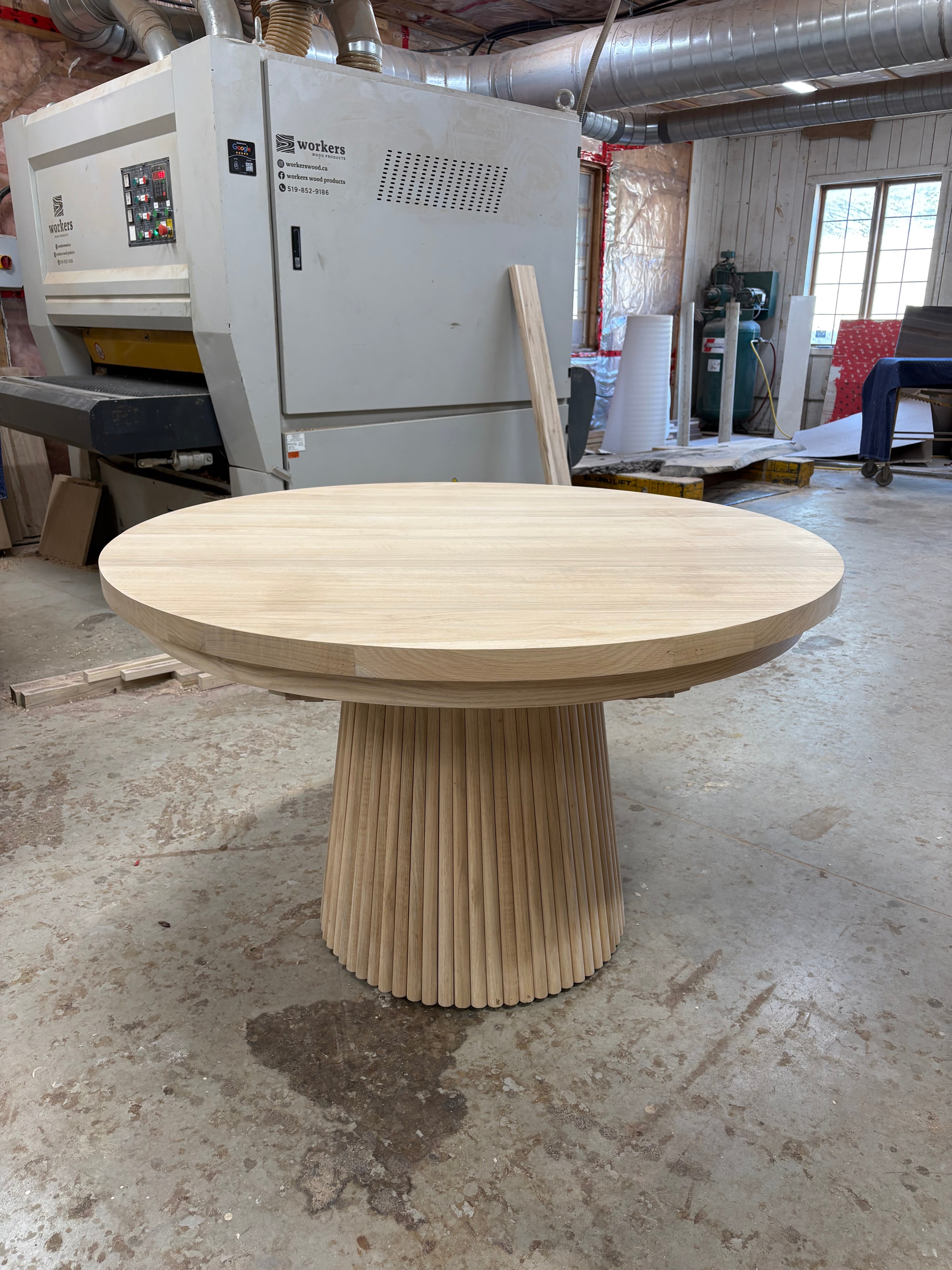 Round wood extendable table with tambour wood base